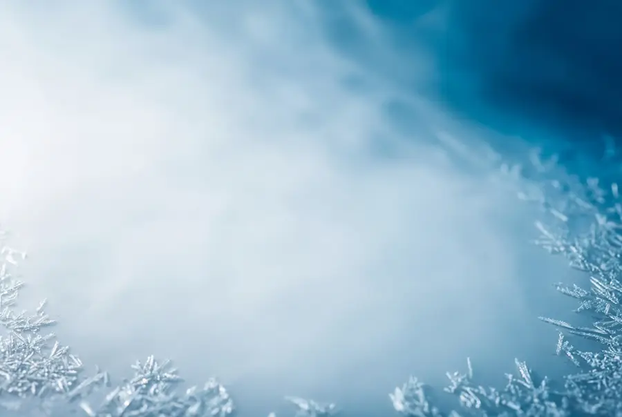 Cold mist and frost crystals spreading over a pale surface